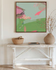 green and blue abstract art print in hallway