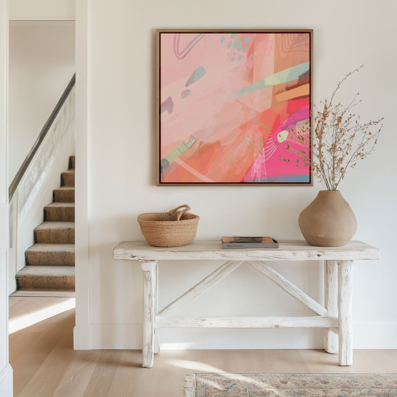 hot pink and blush canvas art on wall in hallway