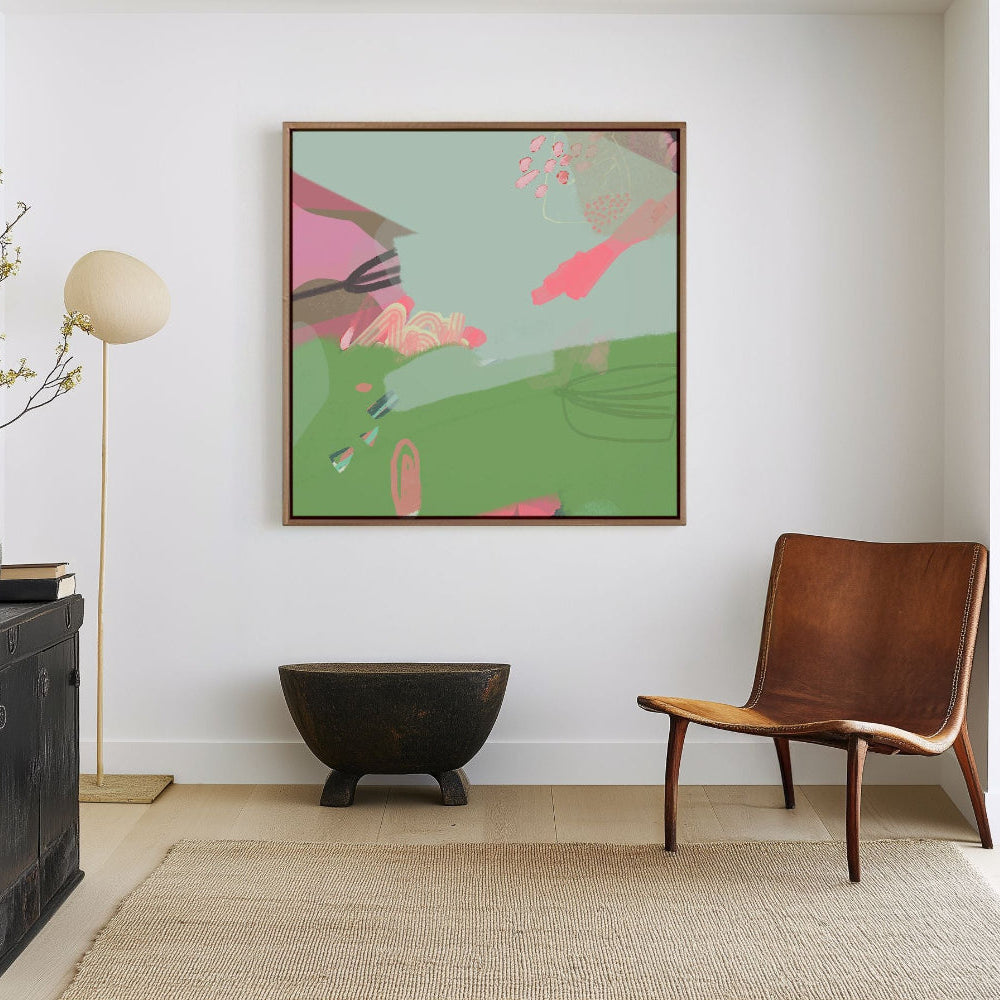 green and blue abstract art print on white wall. framed in oak